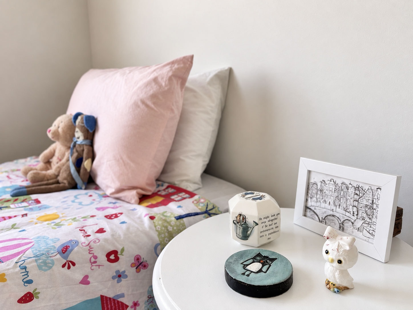 Child's bedroom with colourful toys and patterned bedding