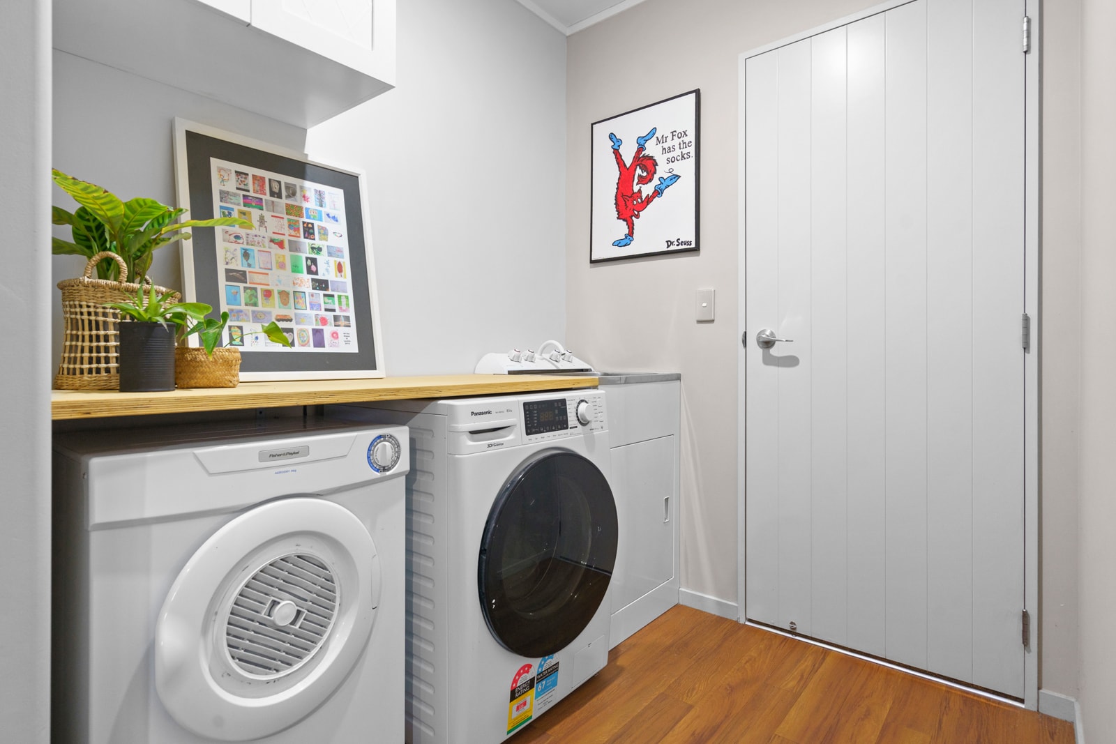 Laundry room with stacked washer and dryer